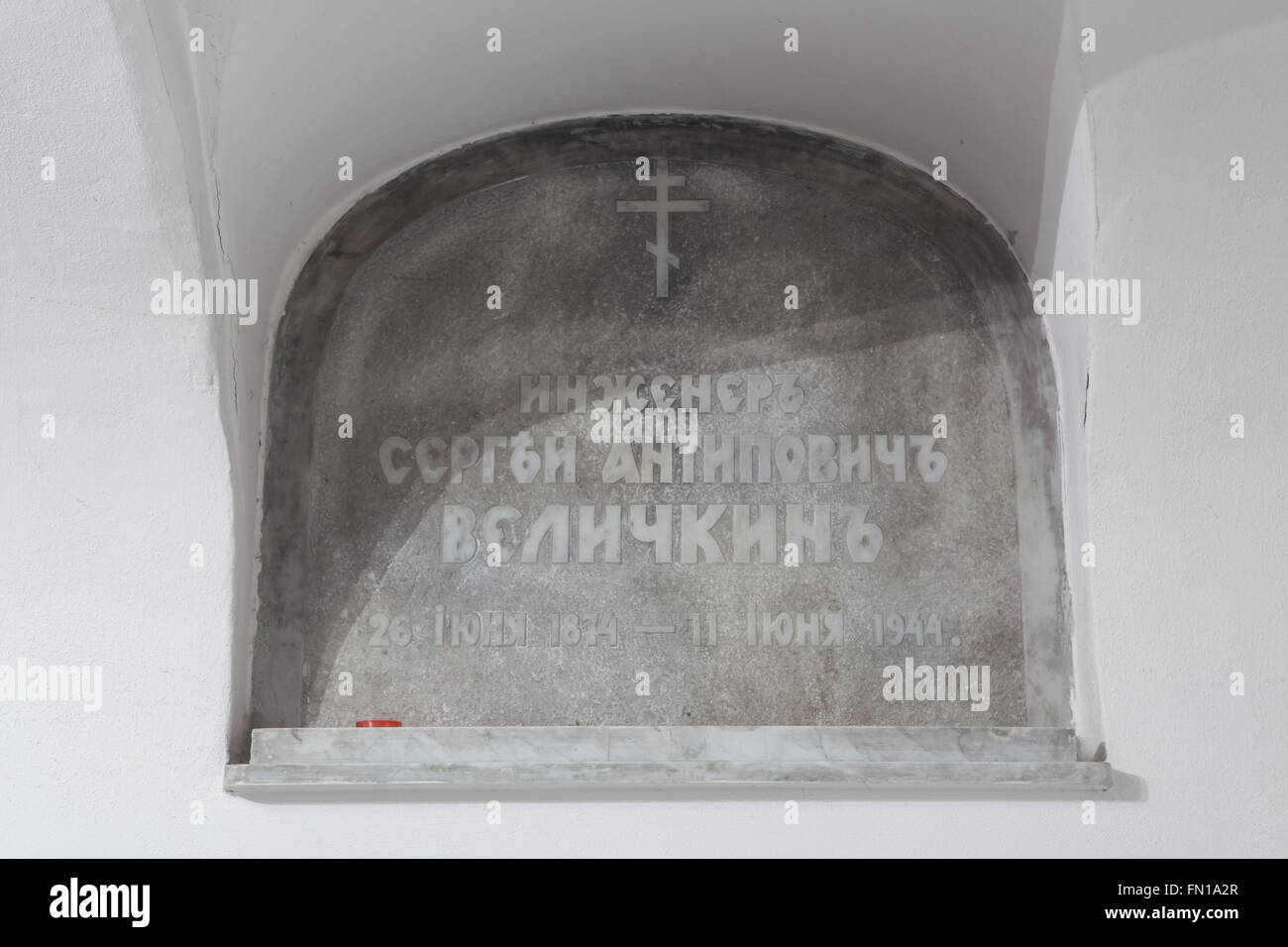 Grave of Russian engineer Sergey Velichkin in the underground crypt of the Dormition Church at the Olsany Cemetery in Prague, Czech Republic. Engineer Sergey Antipovich Velichkin, born June 26, 1874, lived in exile in Czechoslovakia after the Bolshevik Revolution and supervised the construction of the Dormition Church in 1924-1925. He died at age 70 on June 11, 1944. The Dormition church at the Olsany Cemetery was built in 1924-1925 by the Russian white emigre. The underground crypt was used as a burial place for the most notable persons of the Russian emigration in Czechoslovakia. Stock Photo