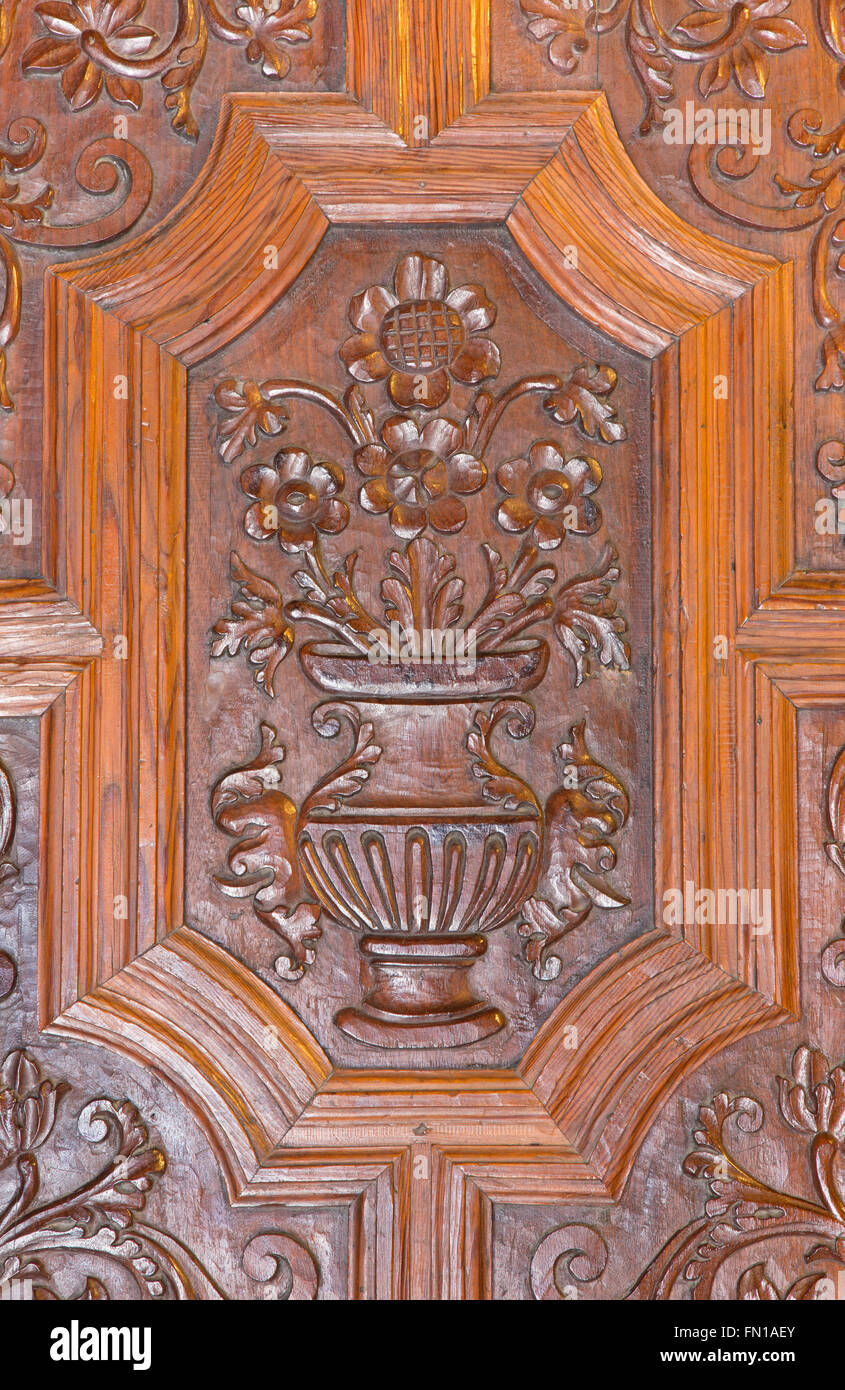 GRANADA, SPAIN - MAY 29, 2015: The detail of carved baroque door of Basilica San Juan de Dios. Stock Photo