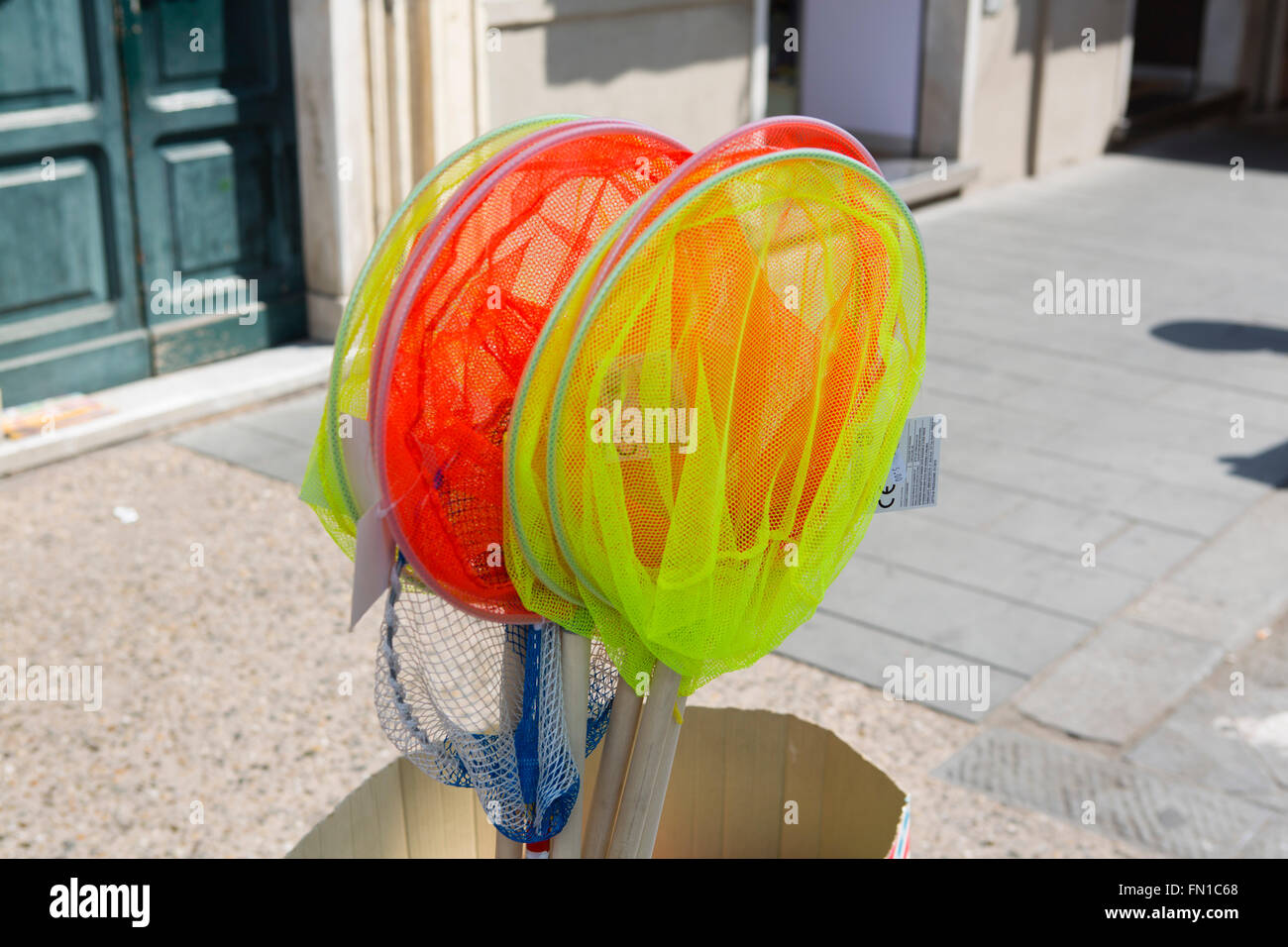 Multi coloured childrens fishing nets Stock Photo Alamy