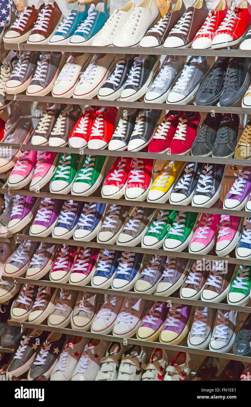 lots of sneaker shoes on sale Stock Photo - Alamy