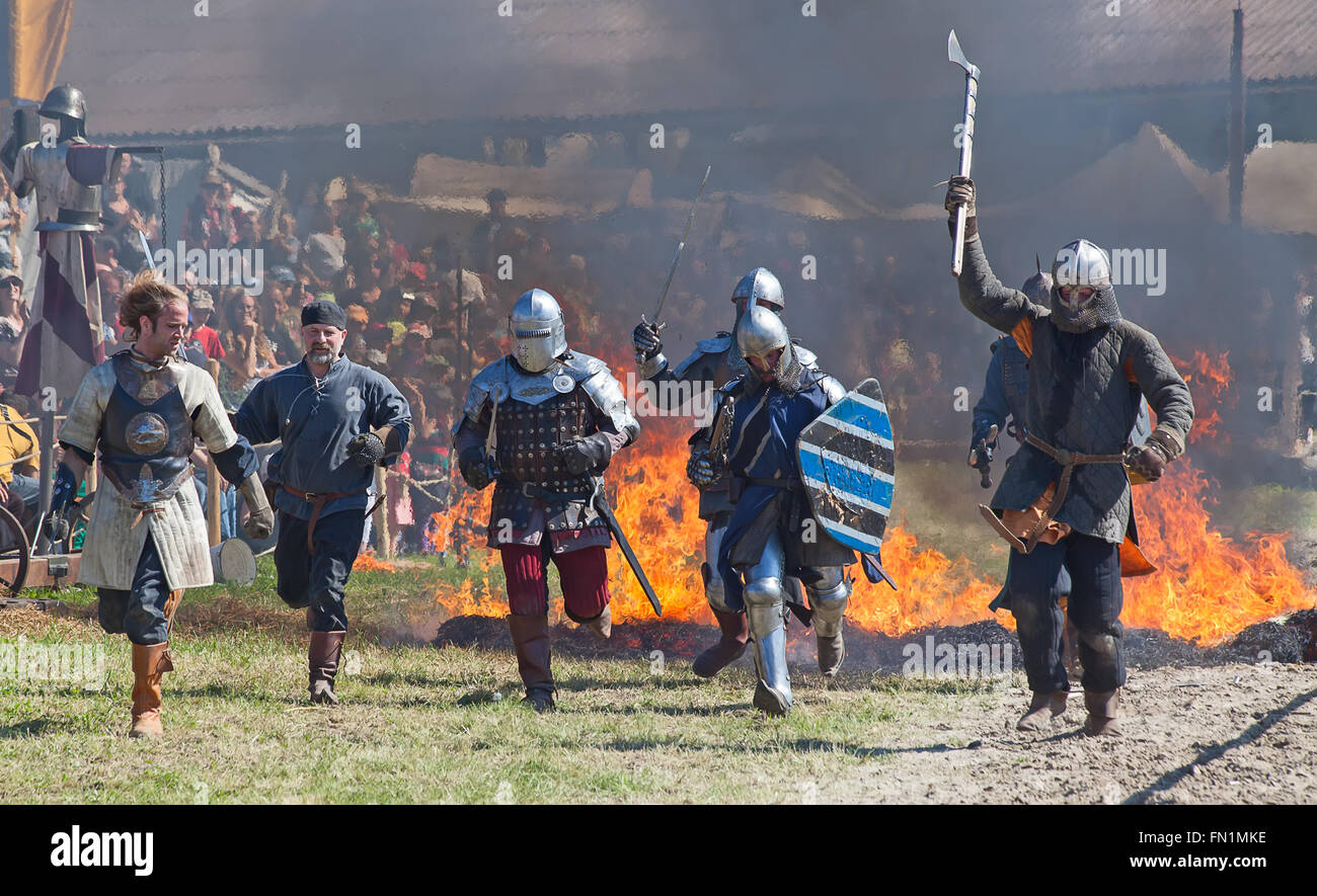 HINWIL, SWITZERLAND - MAY 18: Unidentified men in knight armor demonstrating fighting skills during tournament reconstruction ne Stock Photo