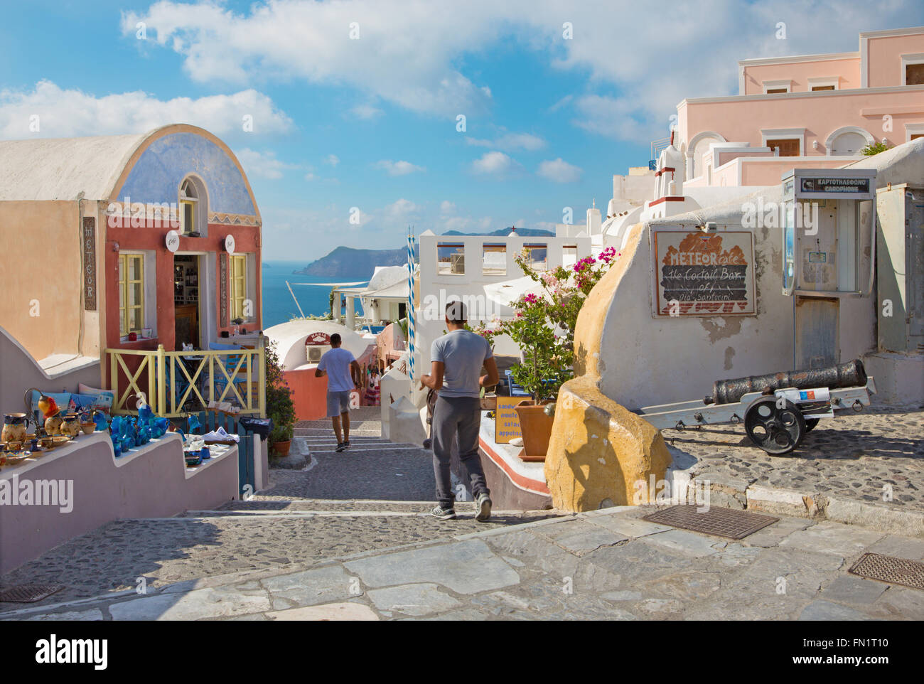 SANTORINI, GREECE - OCTOBER 5, 2015: The street of Oia with the souvenirs shops and restaurants. Stock Photo