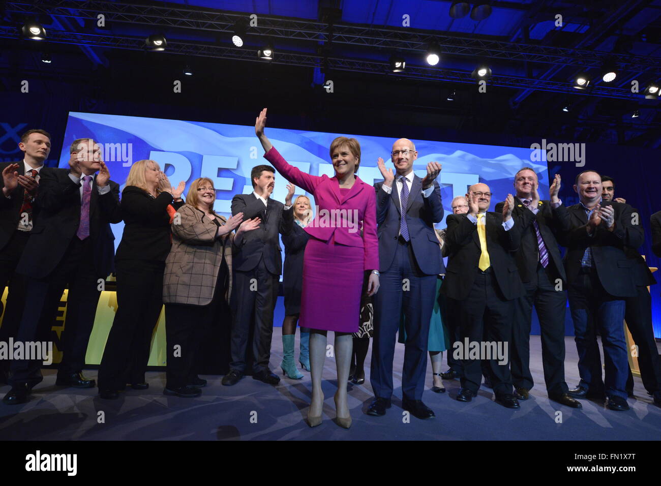 Glasgow, Scotland, GBR - 13  March: Nicola Sturgeon, First Minister of Scotland and SNP Leader and John Swinney, Depute Leader,  with current and prospective MSPs on the final day of the  Scottish National Party Spring Conference took place Sunday 13 March 2016 in Glasgow, Scotland. Stock Photo