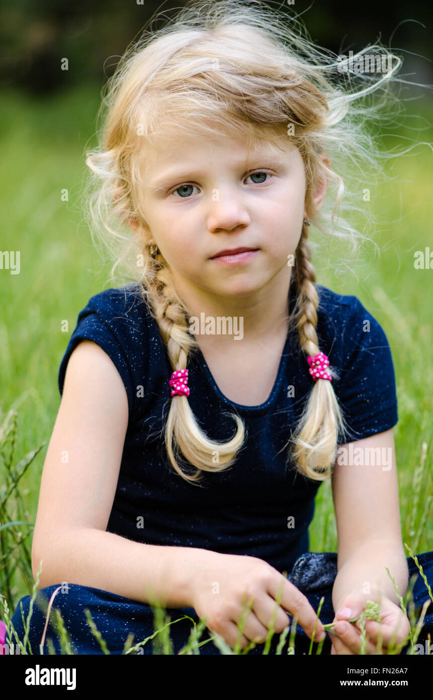 portrait of blond girl with braided hair Stock Photo - Alamy