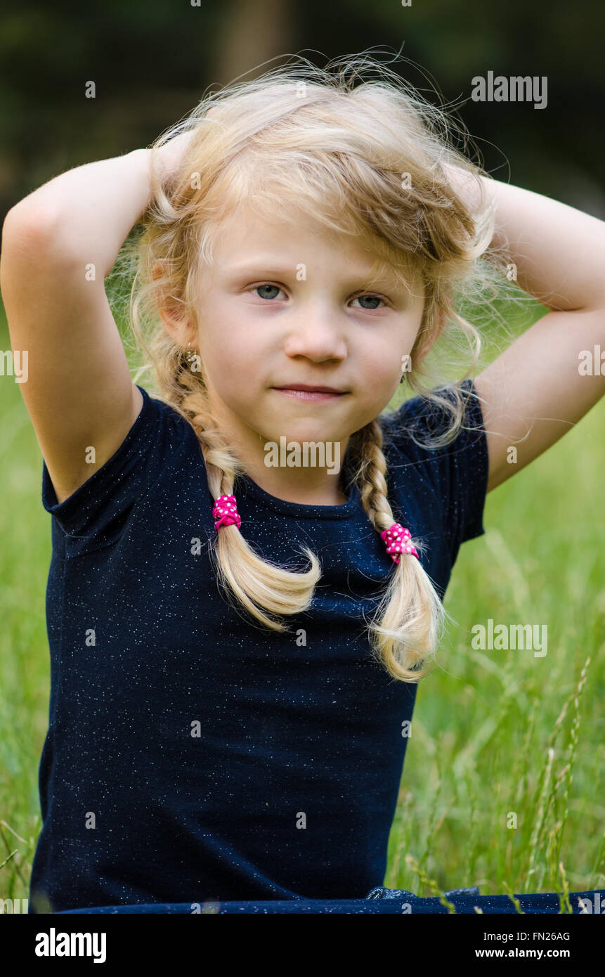 portrait of blond girl with braided hair Stock Photo