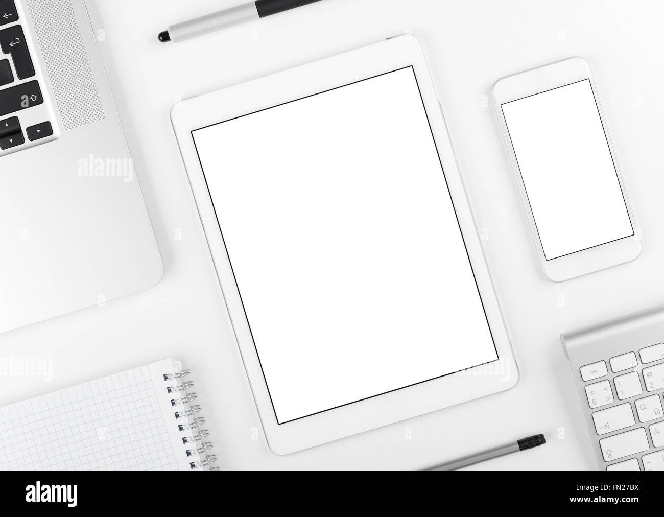Responsive design: Laptop tablet and smartphone on white table Stock ...