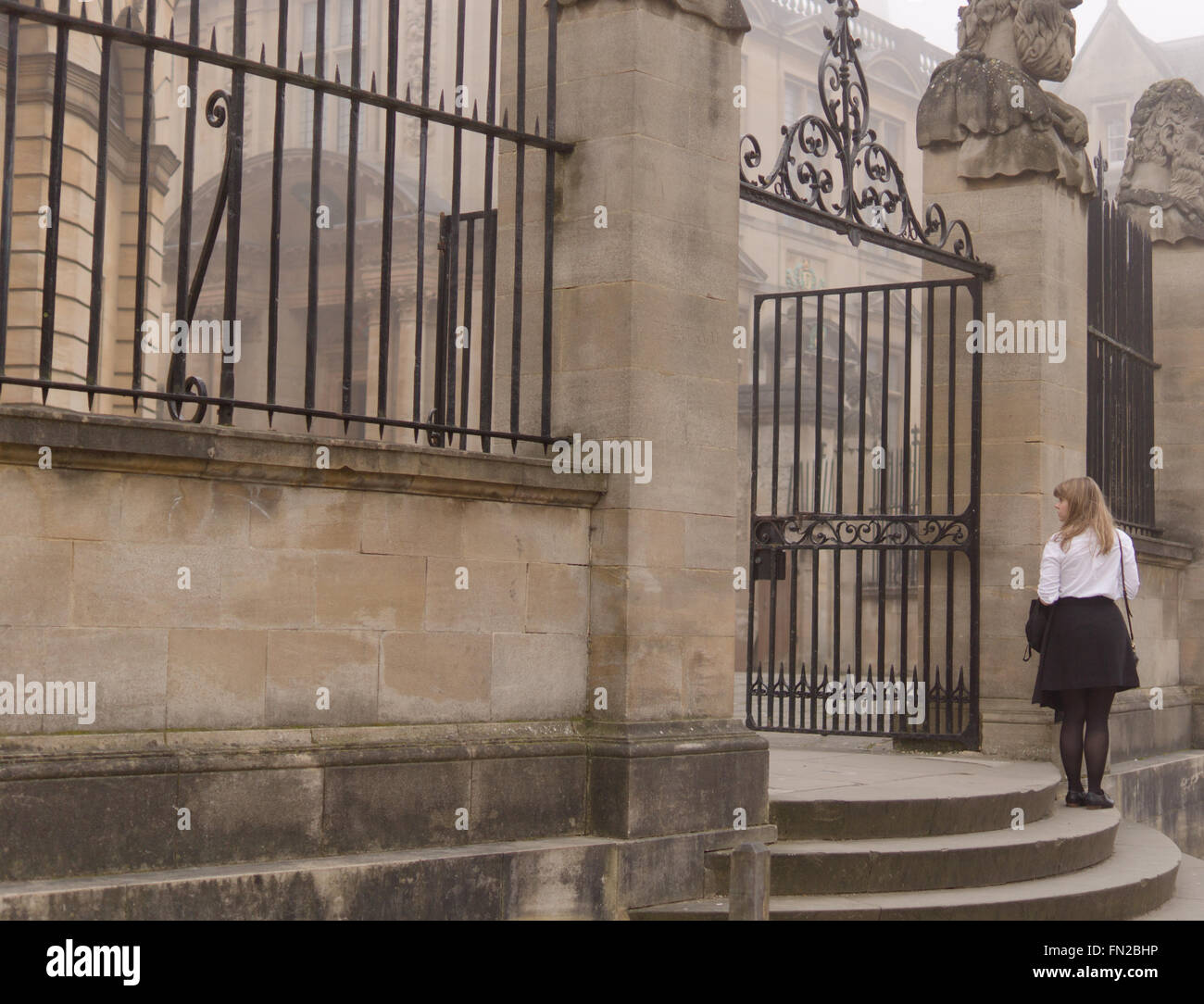 Female university student in traditional white blouse and black skirt uniform worn at a ceremony
