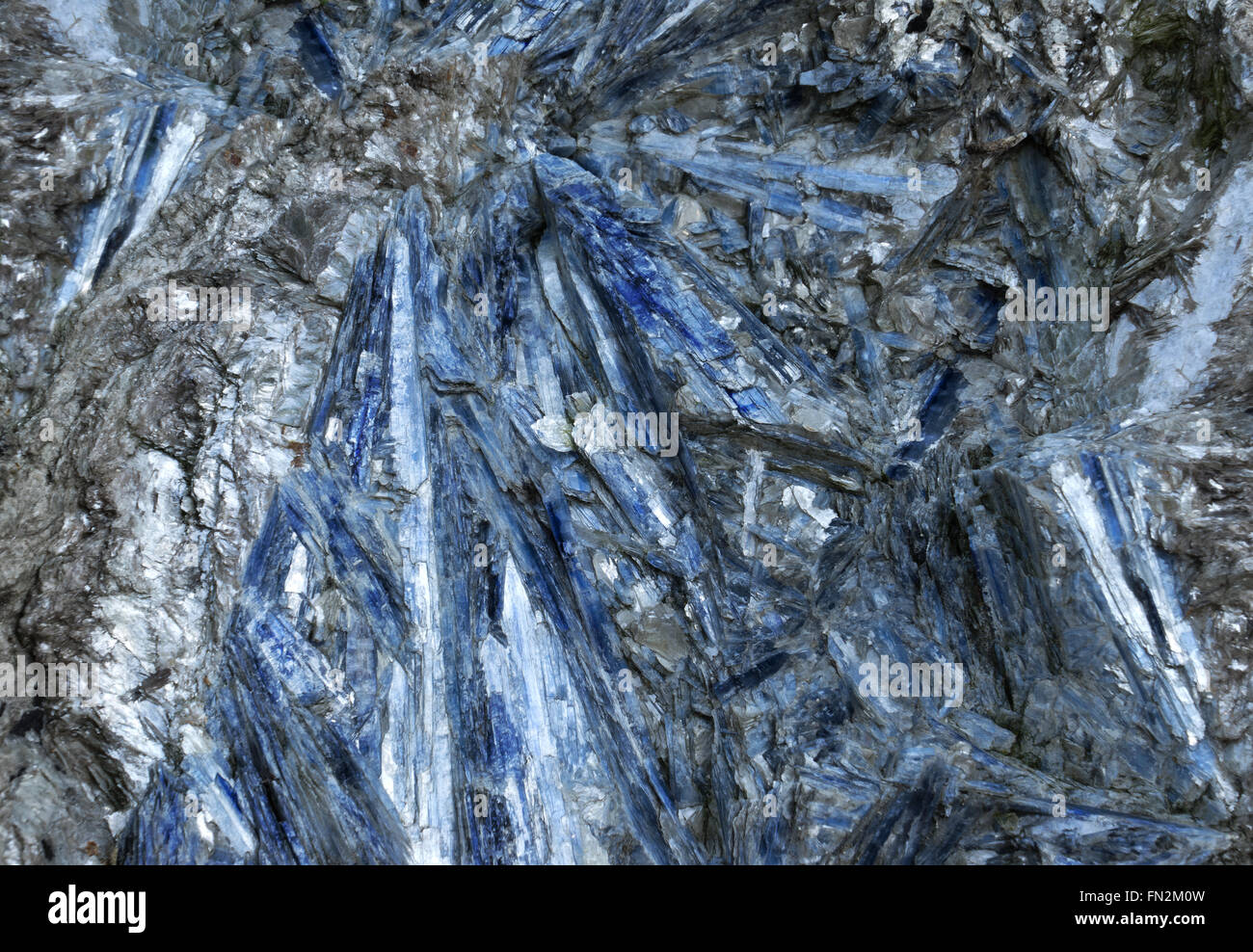 Abstract blue texture with rough surface in a gray silver stone. Taken in close-up. Stock Photo