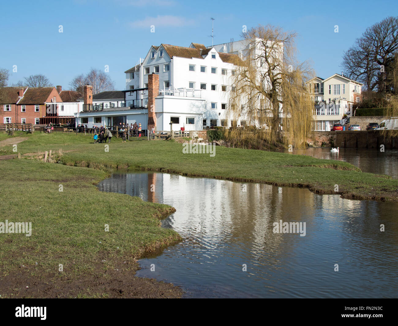 The river Stour in front of an old mill building in Sudbury, Suffolk, England. Stock Photo