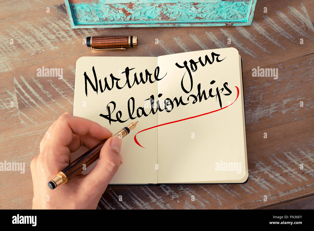 Retro effect and toned image of a woman hand writing a note with a ...