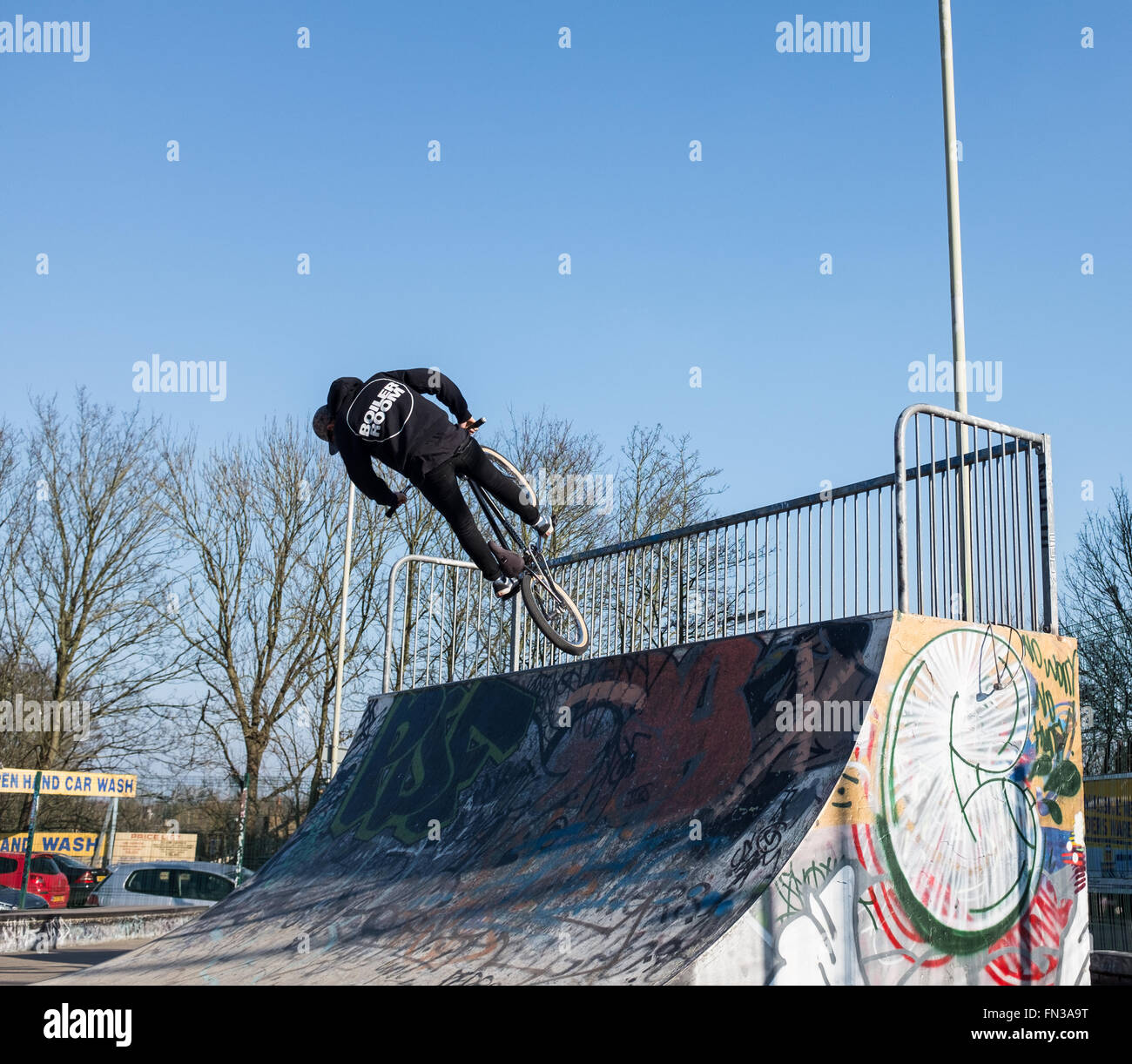 Kid on a stunt bike at a skate park in Watford, herts, UK, next to intu