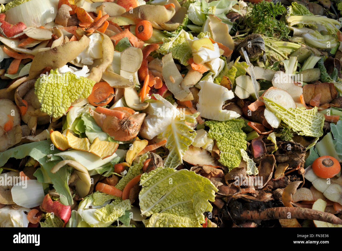 Garden compost heap with kitchen food waste, vegetables, fruit peel and