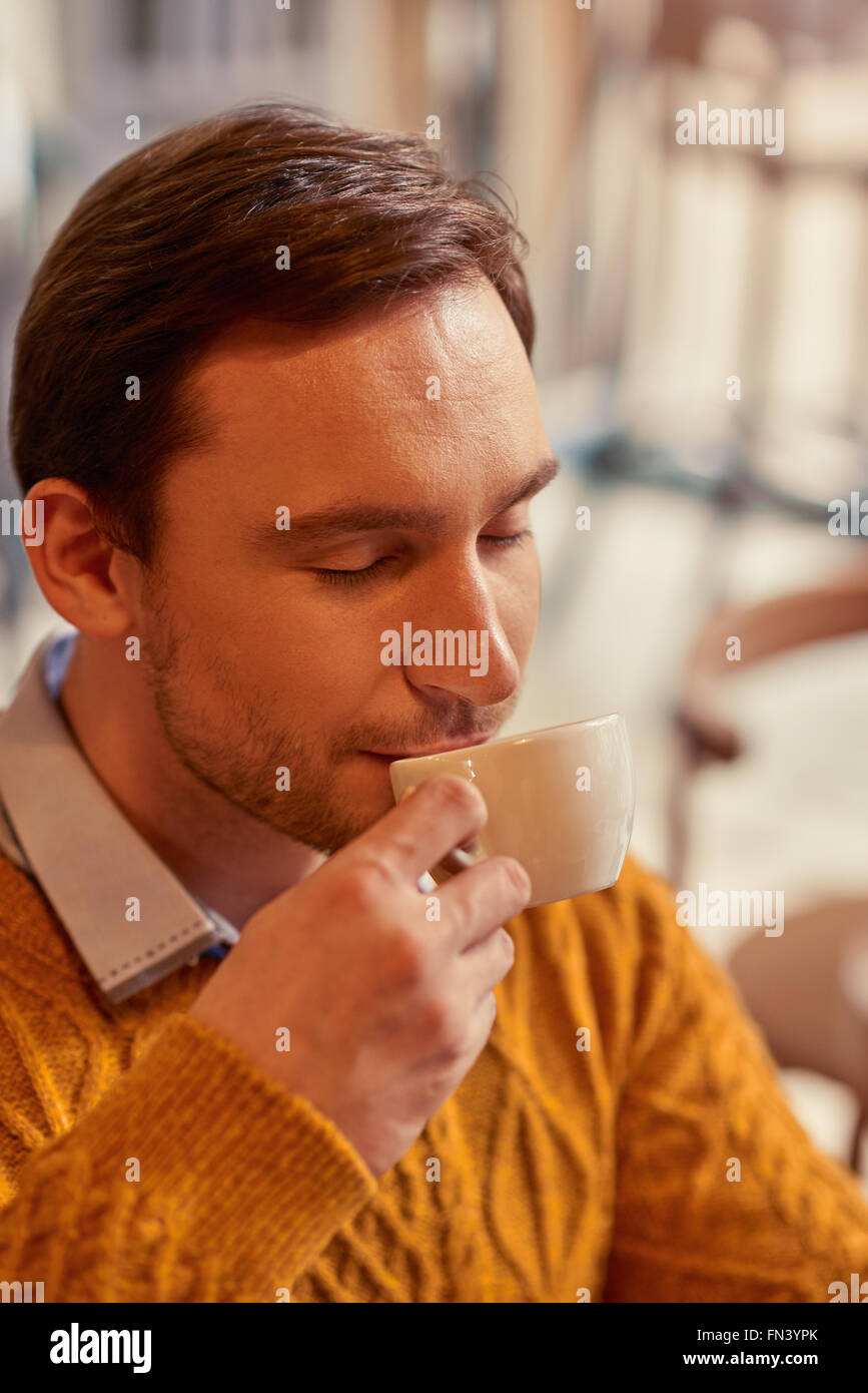 Content man drinking coffee Stock Photo