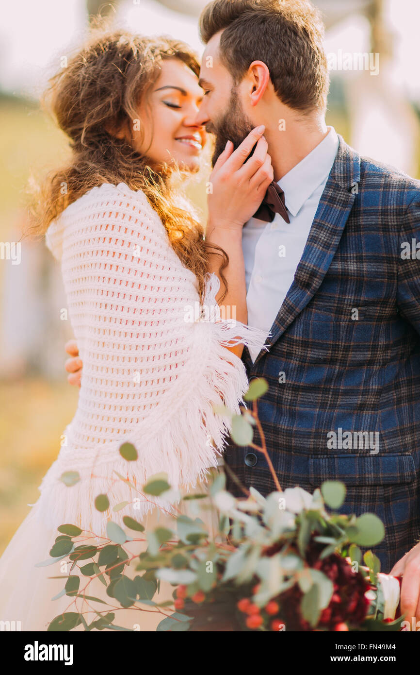 Happy wedding couple softly holding each other close up Stock Photo - Alamy