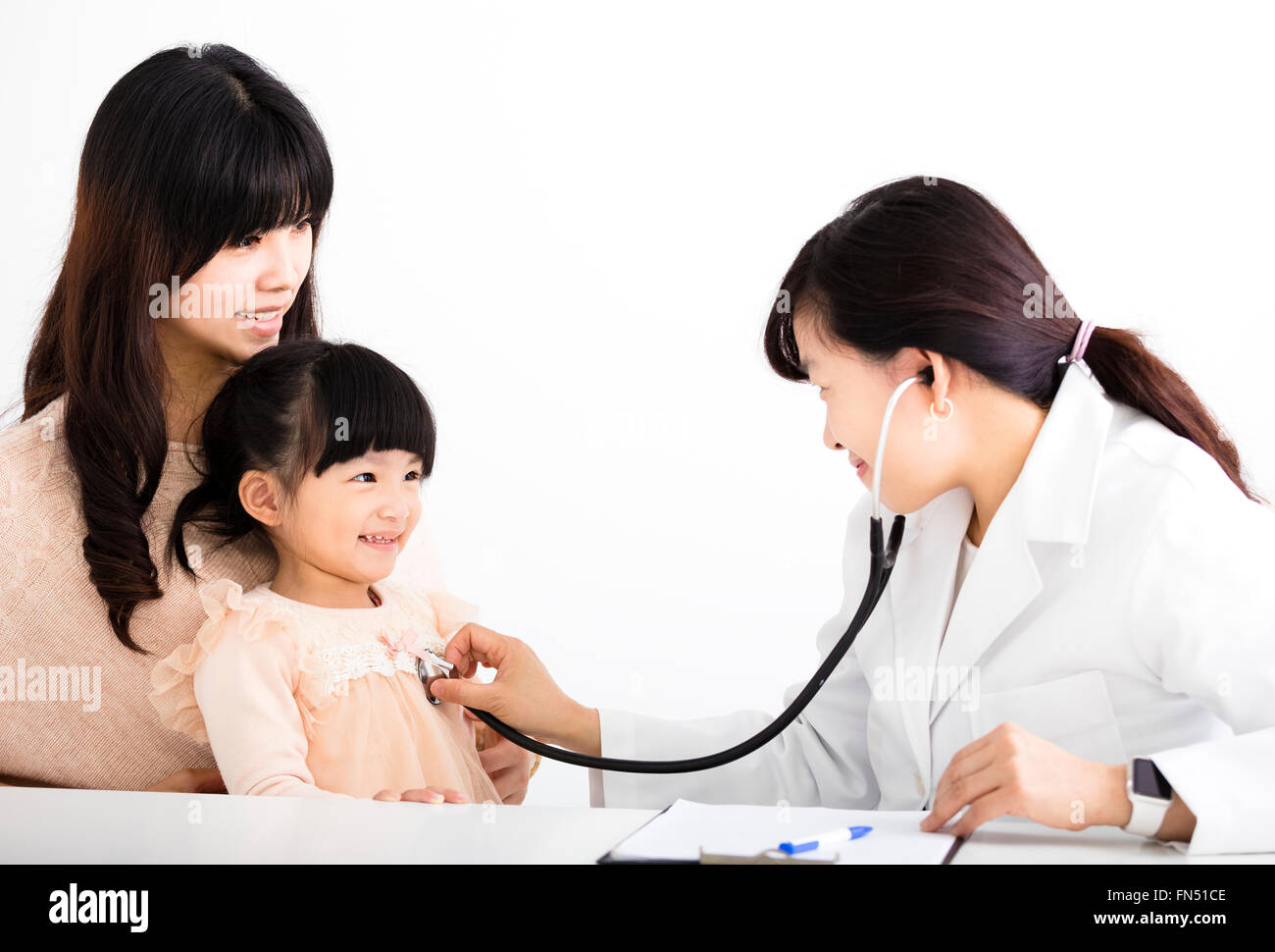young female doctor examining a child patient Stock Photo