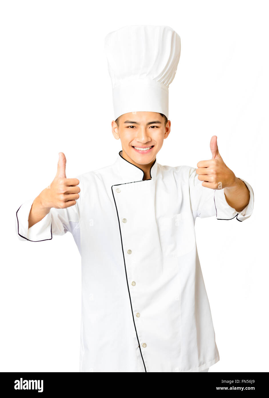 young  male chef with thumb up isolated on white Stock Photo