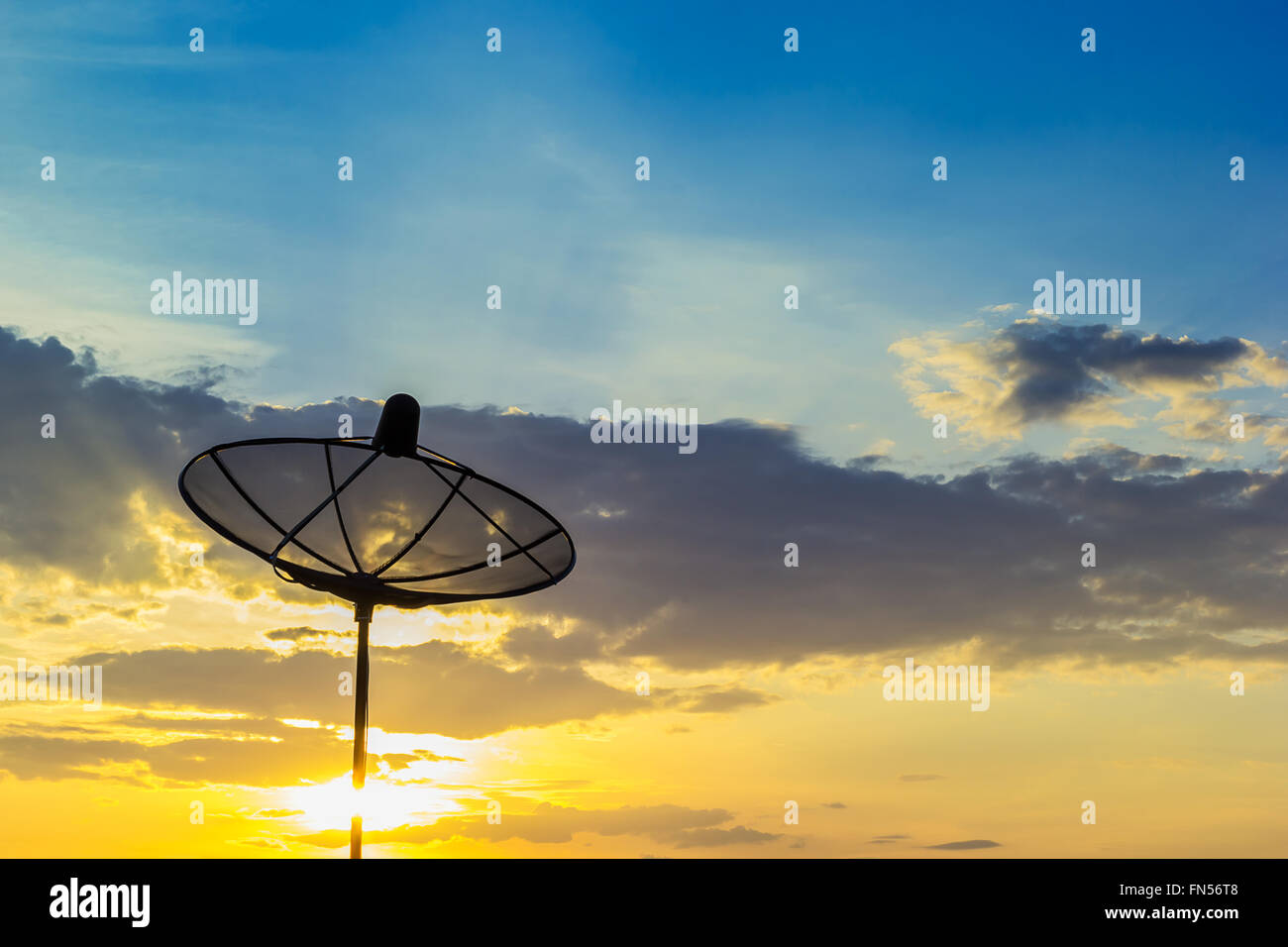 Satellite disk with sunrise background Stock Photo