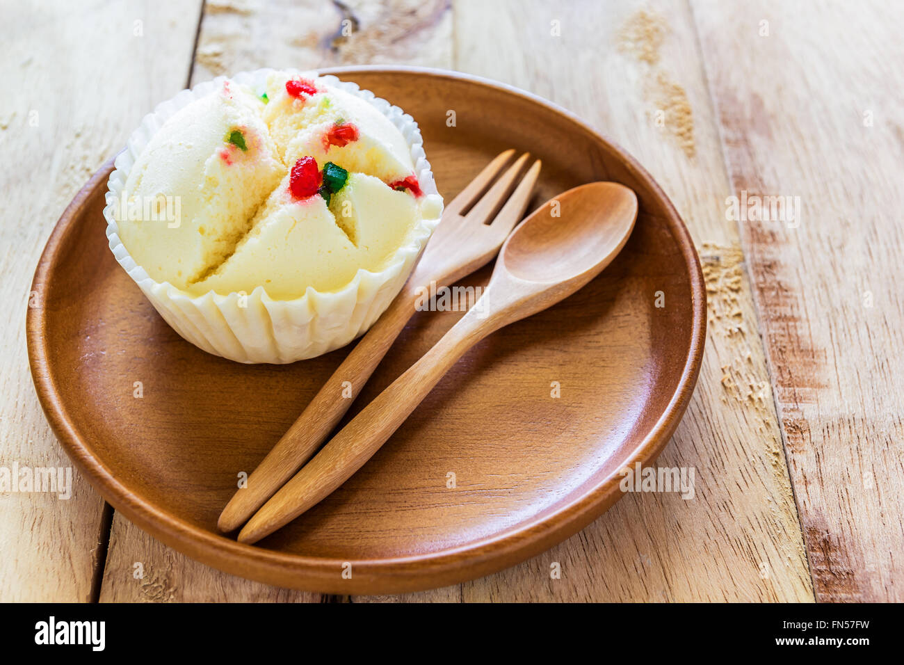 Close up shot Steamed Cup Cake in wood dish on wood table Stock Photo