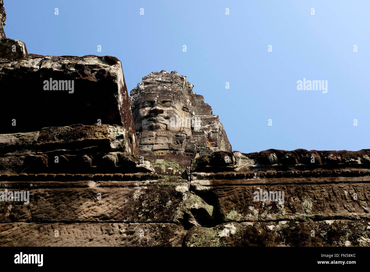 Face Sculpture at Bayon Temple within Angkor Thom near Siem Reap, Cambodia Stock Photo