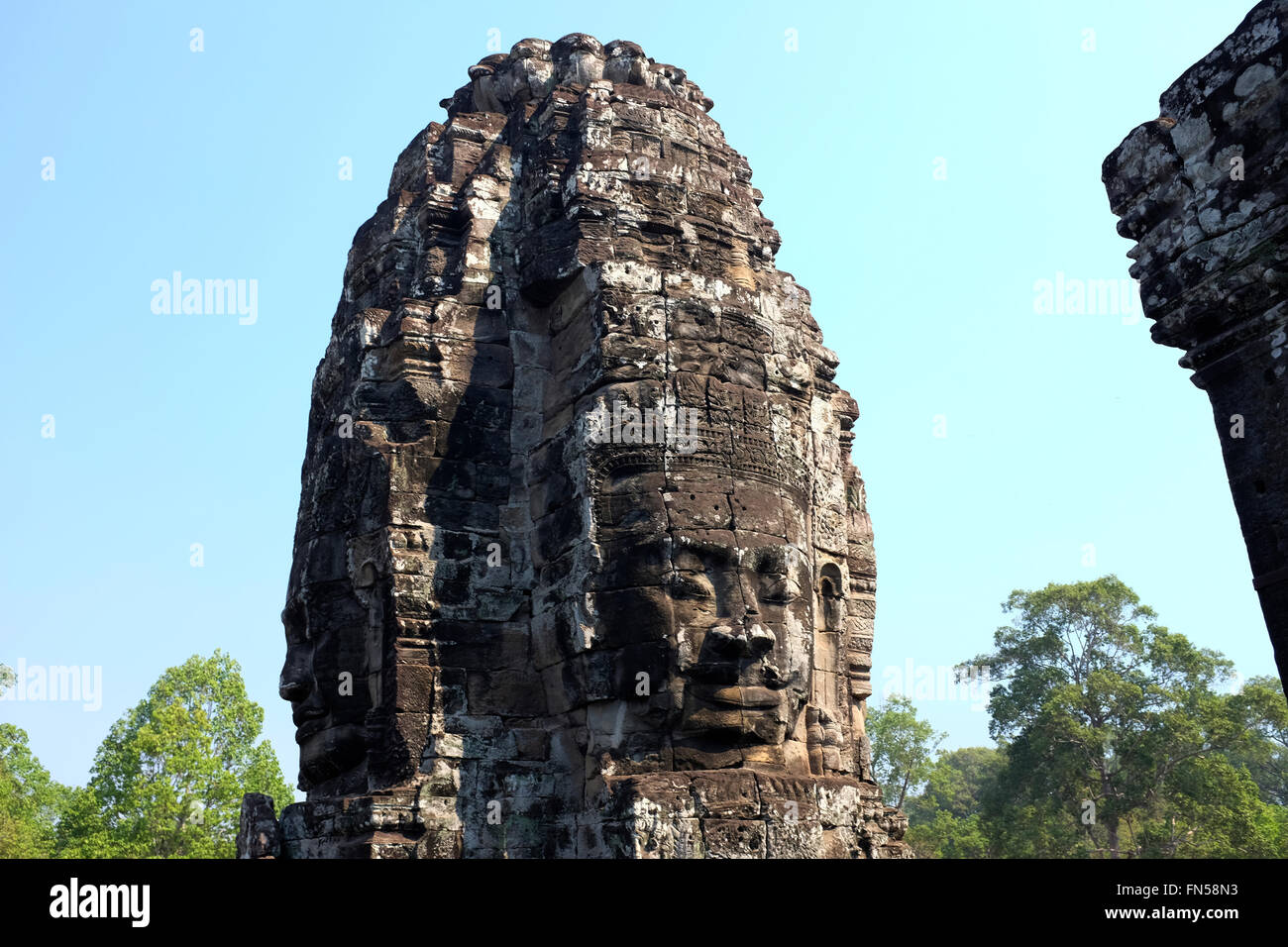 Face sculpture at Bayon Temple within Angkor Thom near Siem Reap, Cambodia Stock Photo