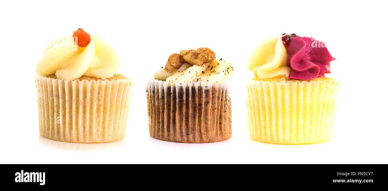 Three Cup Cakes In a row on a white background Stock Photo