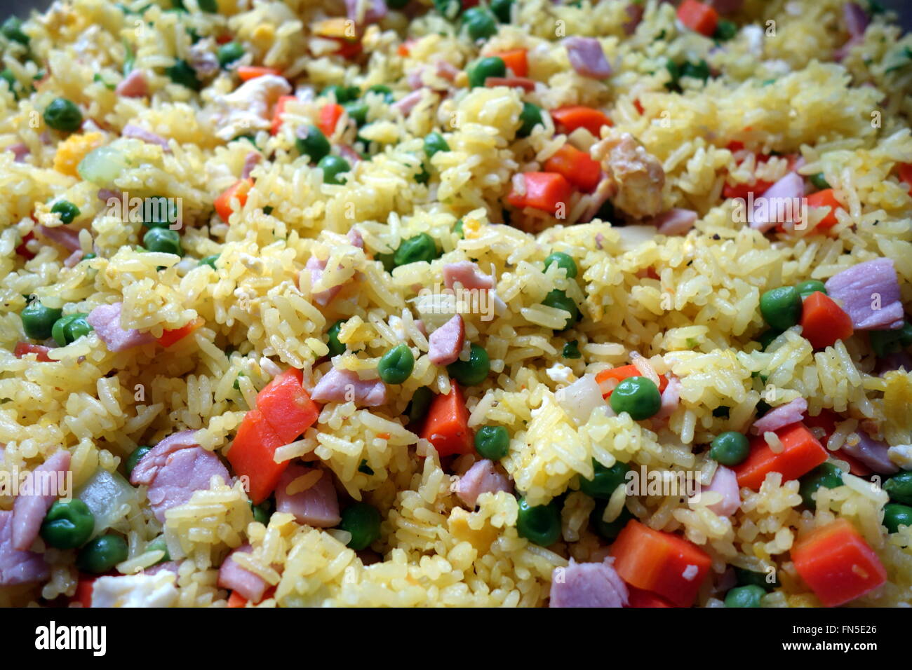 Ham and Vegetable Saffron Fried Rice Stock Photo - Alamy