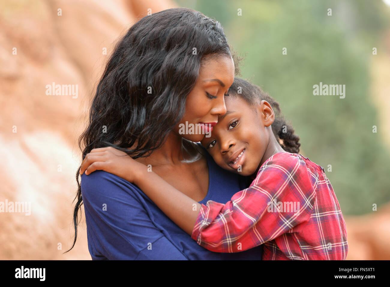 Loving mother comforting her little daughter Stock Photo