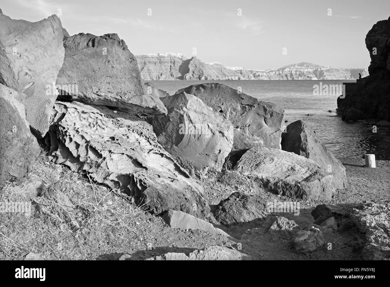 Santorini - The look to caldera across the pumice boulders with the Skyros ans Imerovigili in the background. Stock Photo