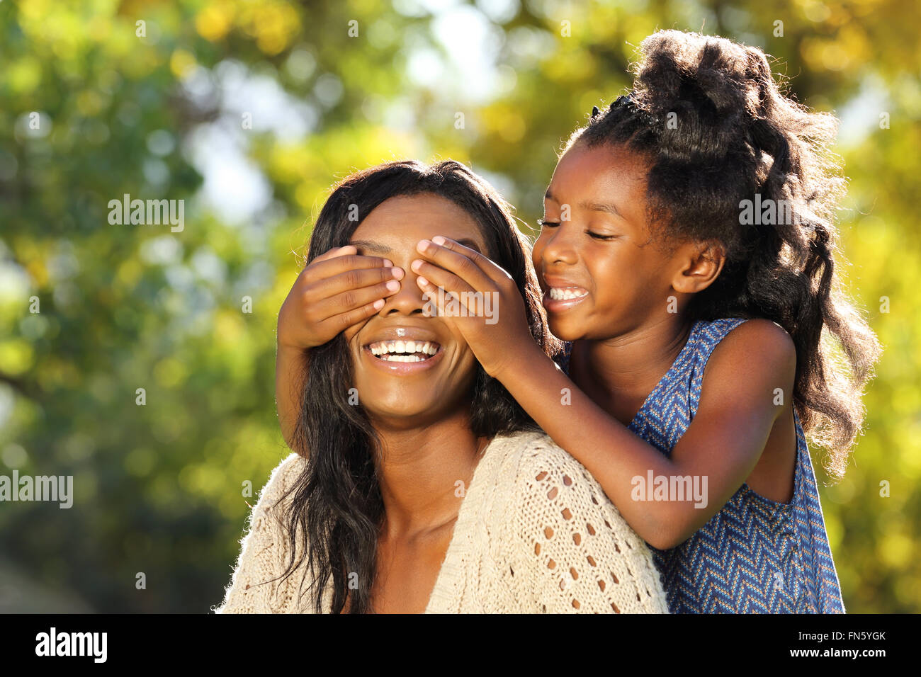 Mother and child heaving fun playing peekaboo Stock Photo