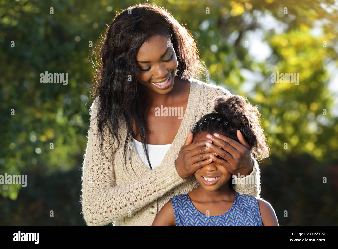 Mother and child heaving fun playing peekaboo Stock Photo