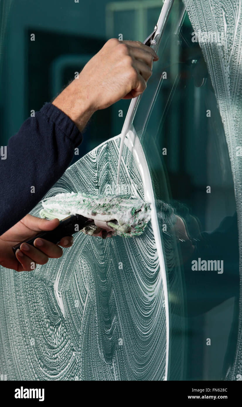Using Squeegy Person using squeegee clean glass hi-res stock photography and images ...
