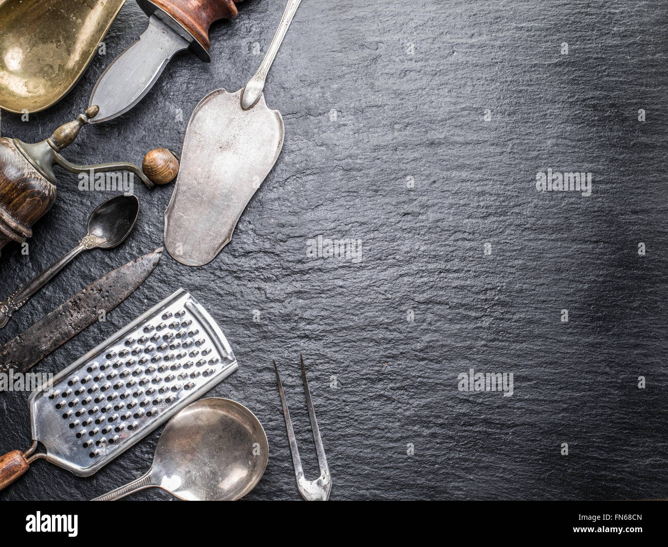Kitchen utensils on the graphite background Stock Photo Alamy