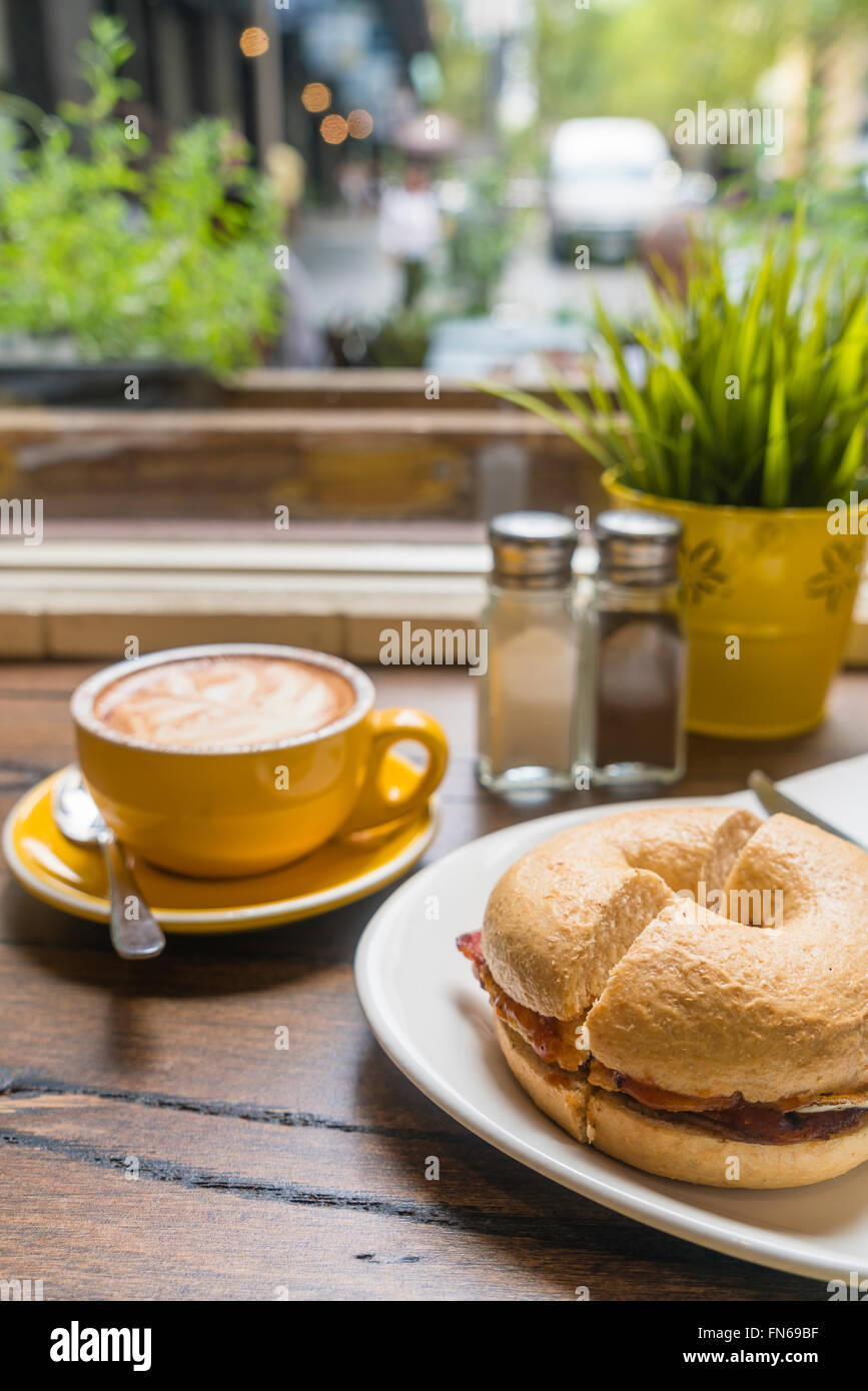Coffee and bagel in a cafe Stock Photo