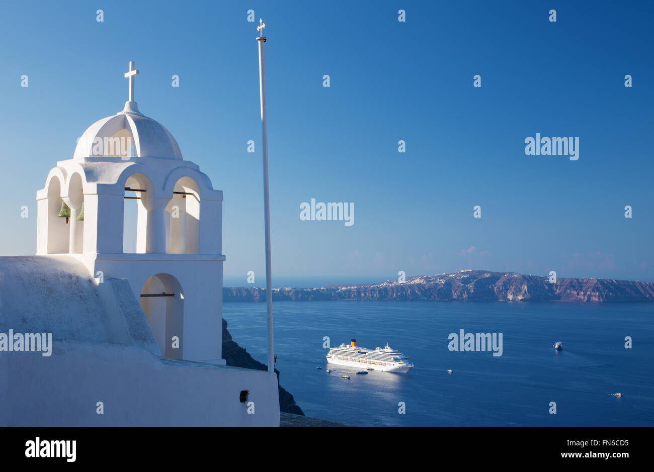 Santorini - The outlook from Fira ower the church tower to caldera and the cruise. Stock Photo