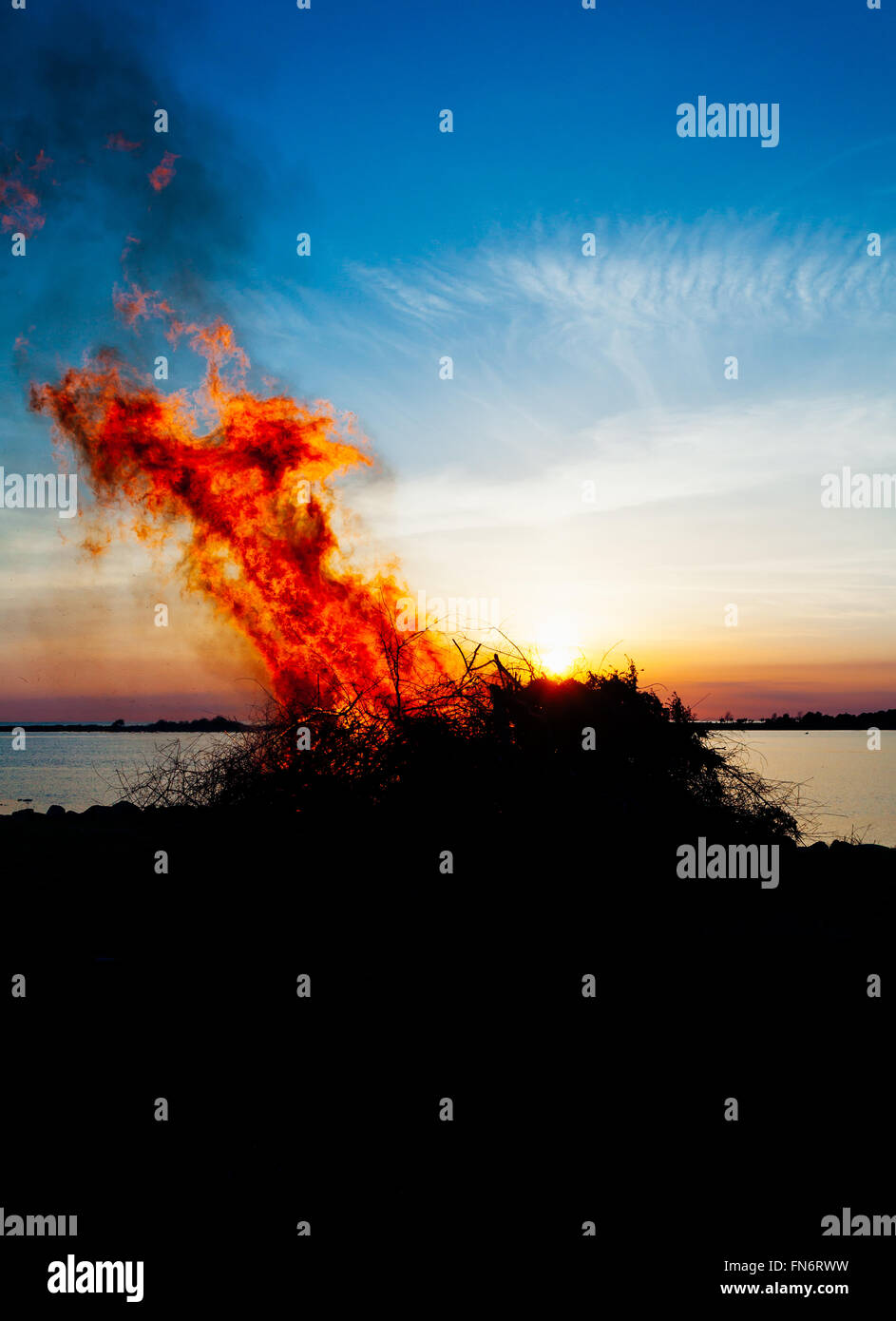 celebrating Walpurgisnight in Sweden bonfire by the sea Stock Photo