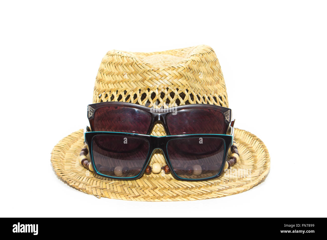 Straw hat and two sunglasses on vacation isolated Stock Photo - Alamy