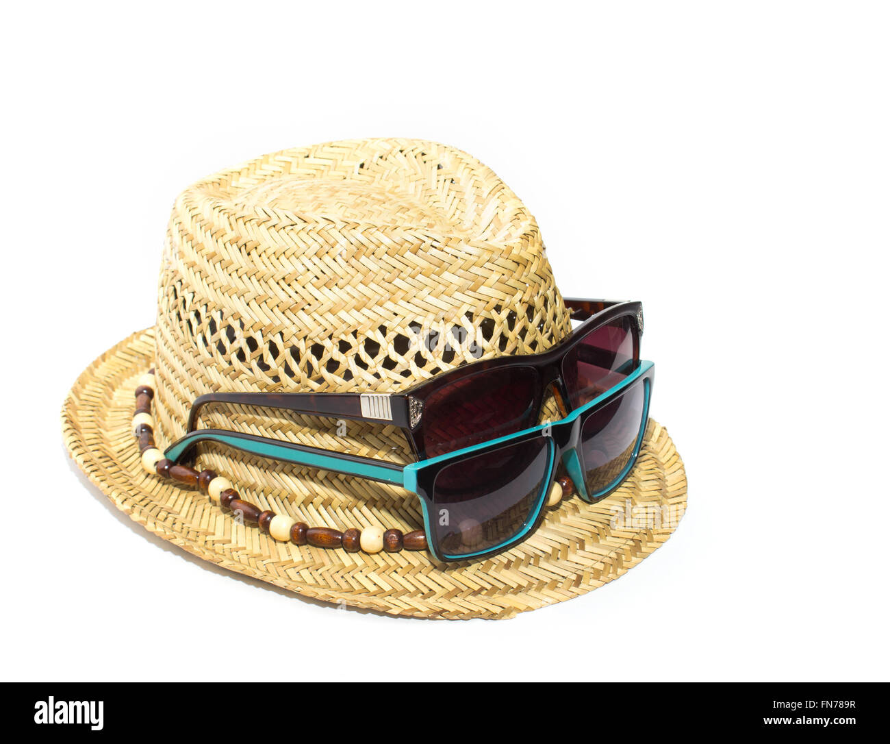 Straw hat and two sunglasses on vacation isolated Stock Photo - Alamy