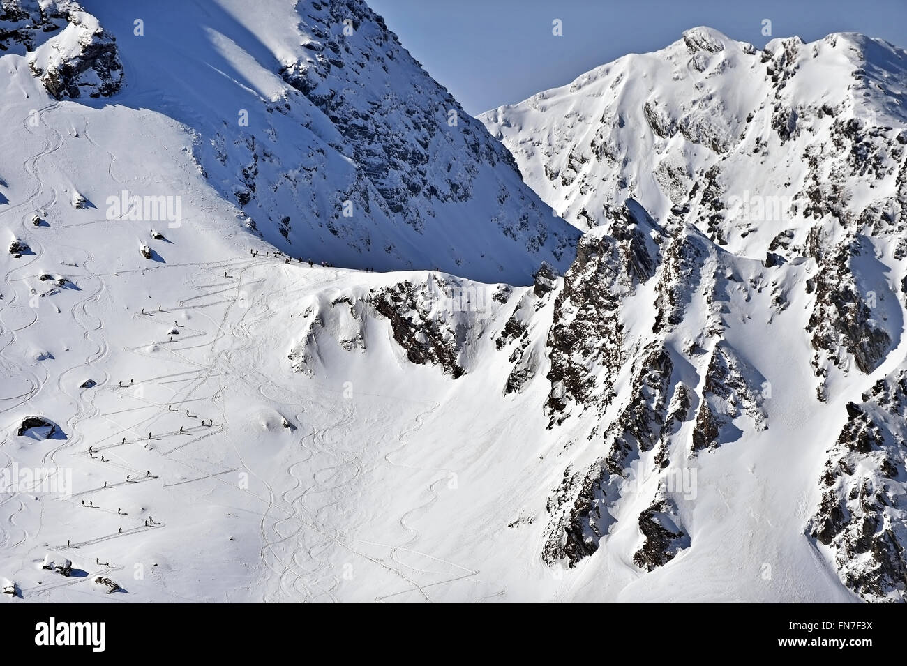 Ski mountaineers are competing during the Ski Mountaineering National Competition in Fagaras Mountains, in Romania. Stock Photo