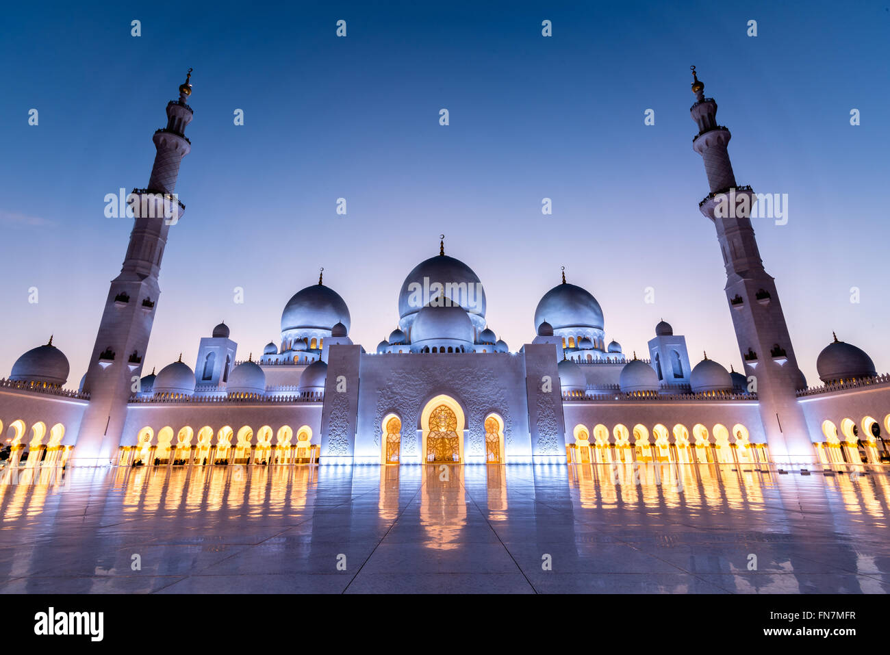 Courtyard of the Sheikh Zayed Grand Mosque in Abu Dhabi captured at sunset Stock Photo