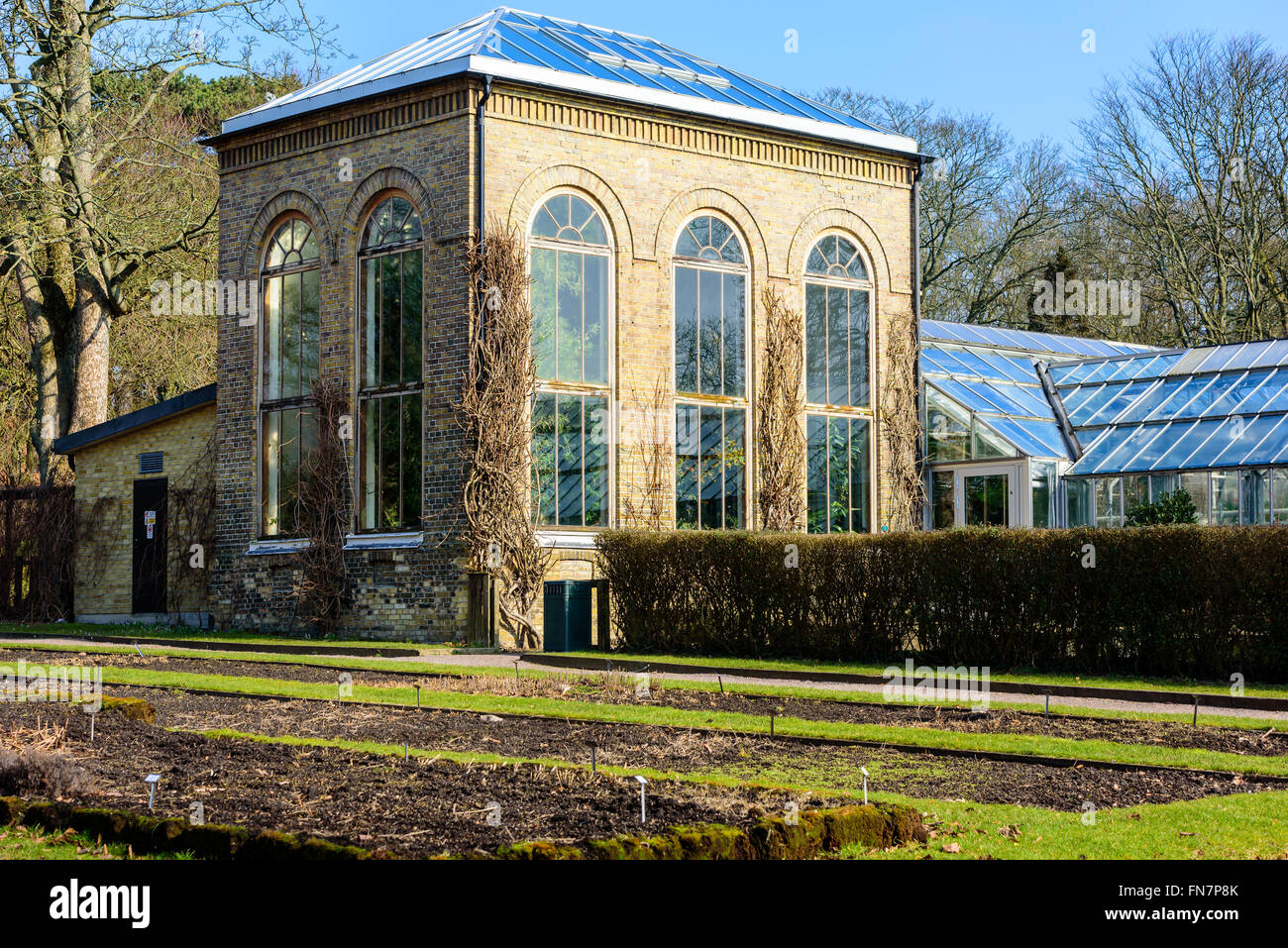 Lund, Sweden - March 12, 2016: The conservatory or orangery building at the publicly open Lund university botanical garden. Flow Stock Photo