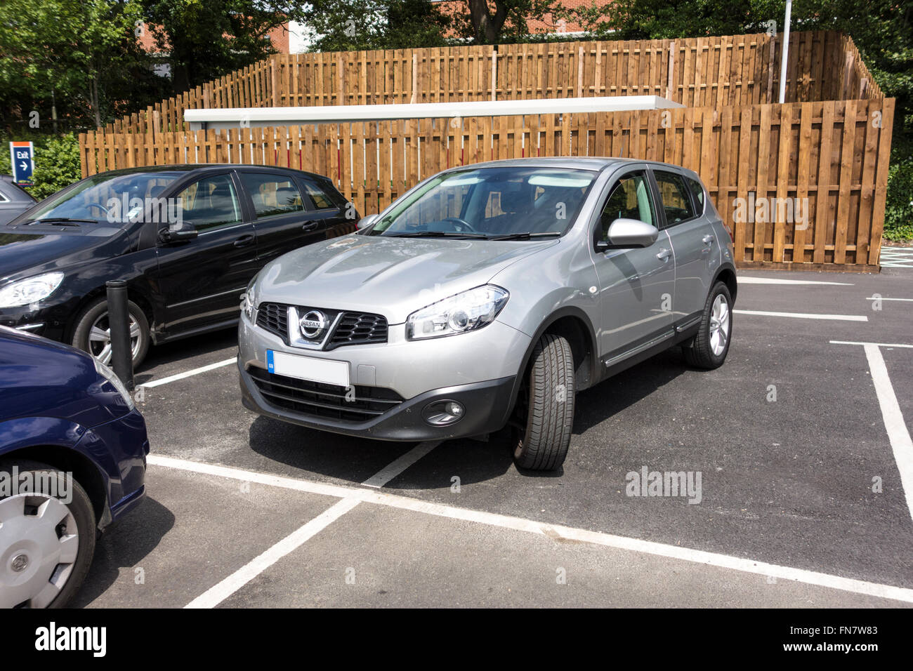 Inconsiderate parking in a car park, UK. Stock Photo