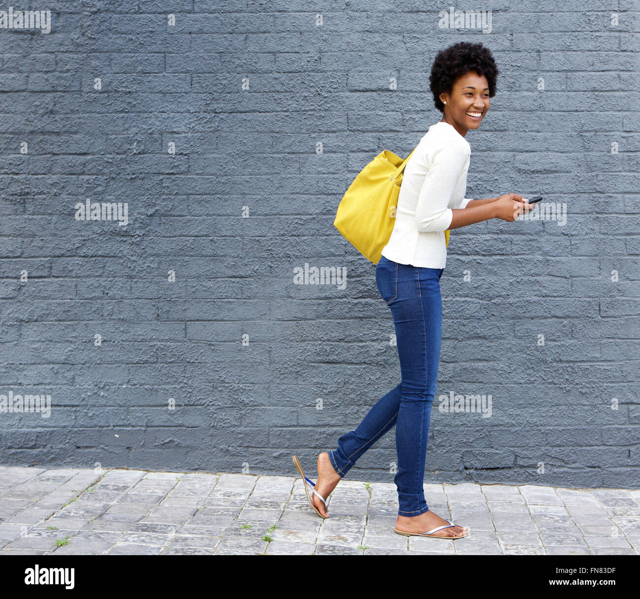African woman walking hi-res stock photography and images - Alamy