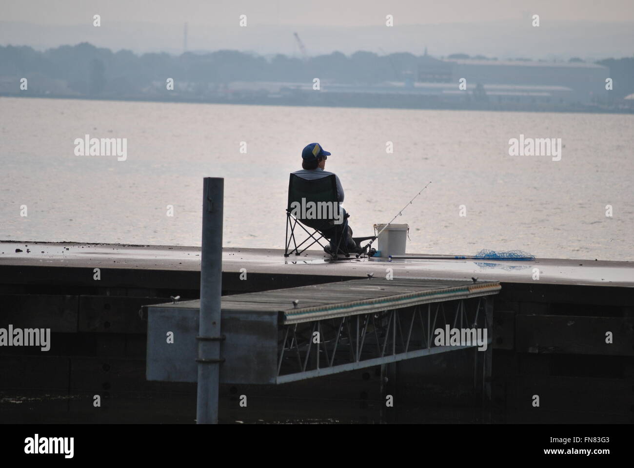 Fishing Off a Pier on Lake Erie Stock Photo