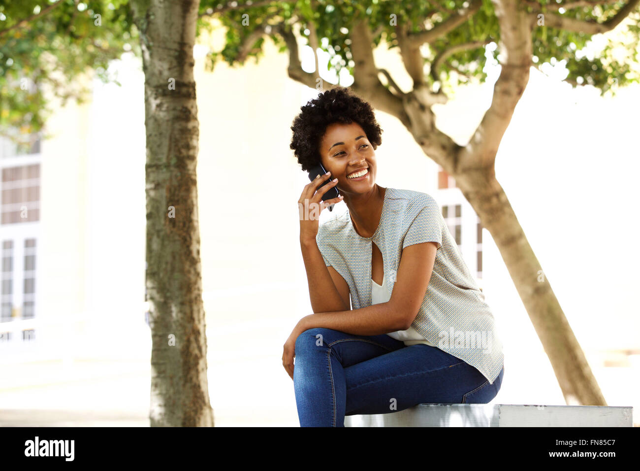 African woman sitting hi-res stock photography and images - Alamy