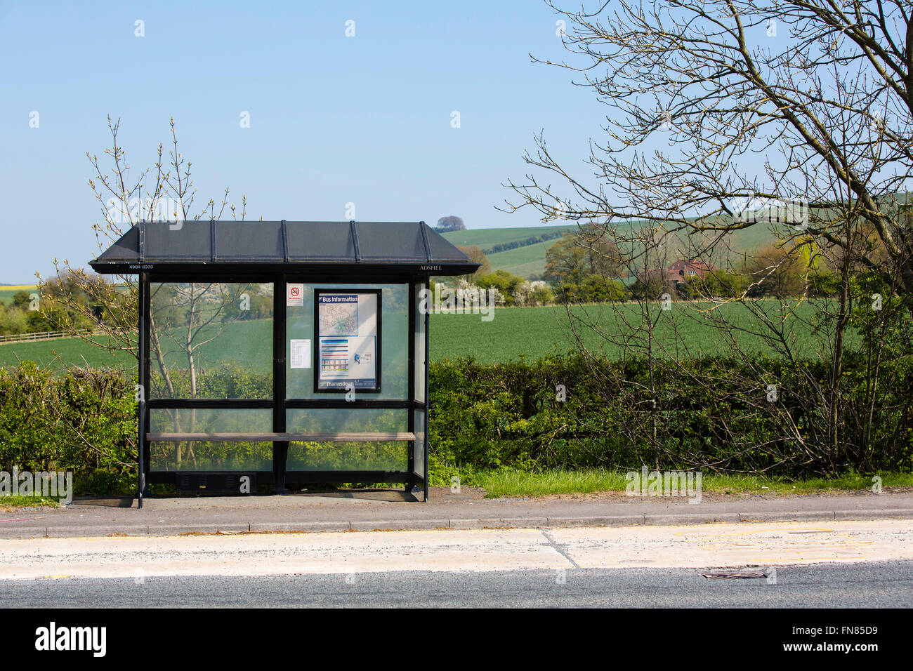 Small local bus stop in front of fields Stock Photo Alamy
