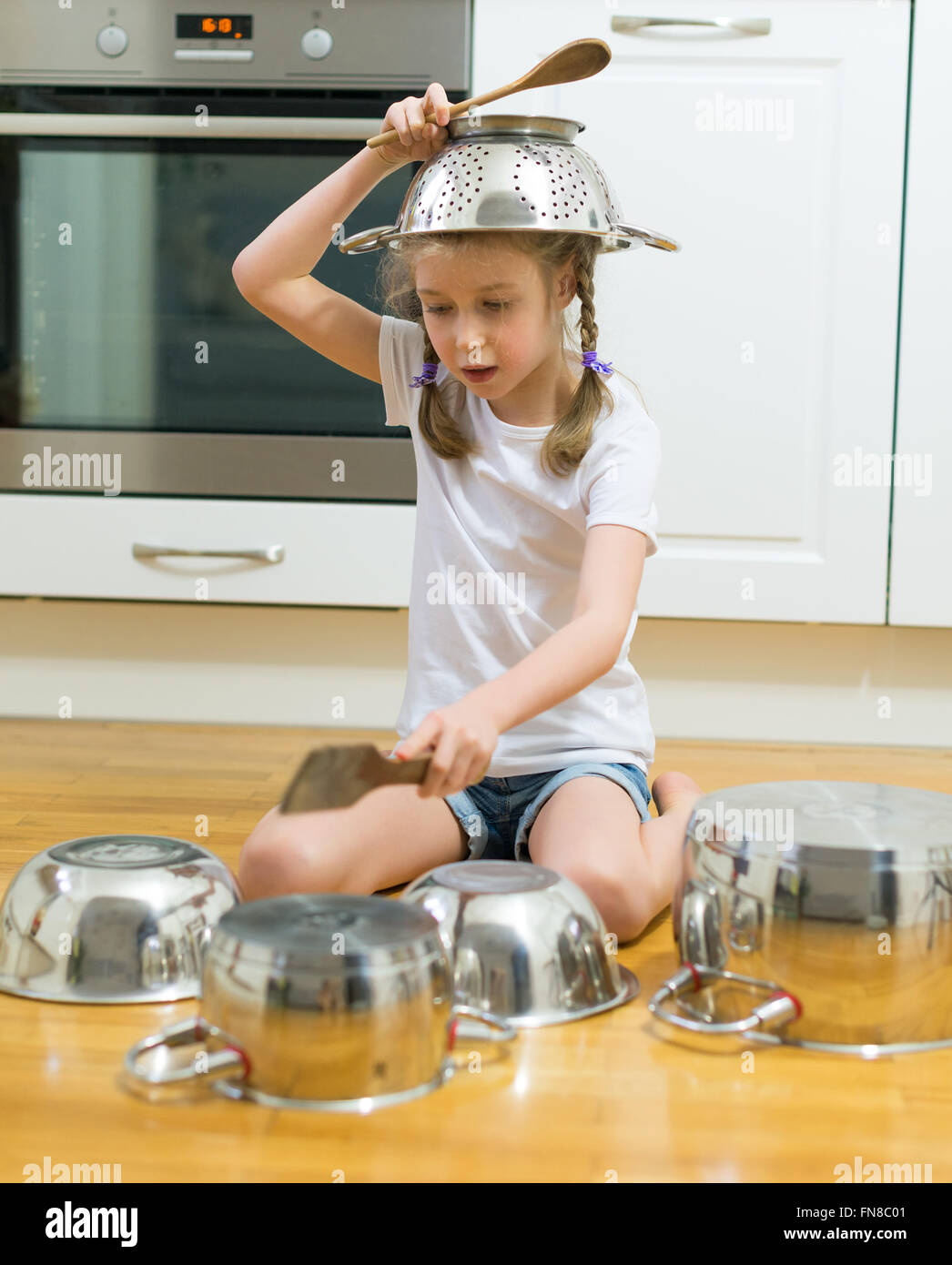 Little girl playing drums hires stock photography and images Alamy