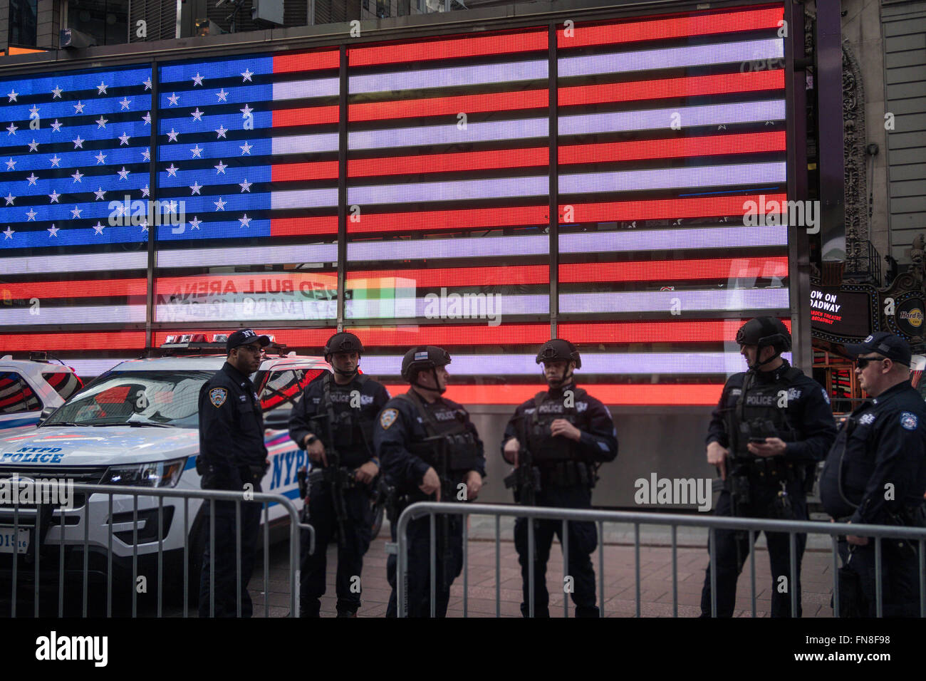Swat Team in front of the American Flag on the U.S. Recruiting Station, Times Square, NYC Stock Photo