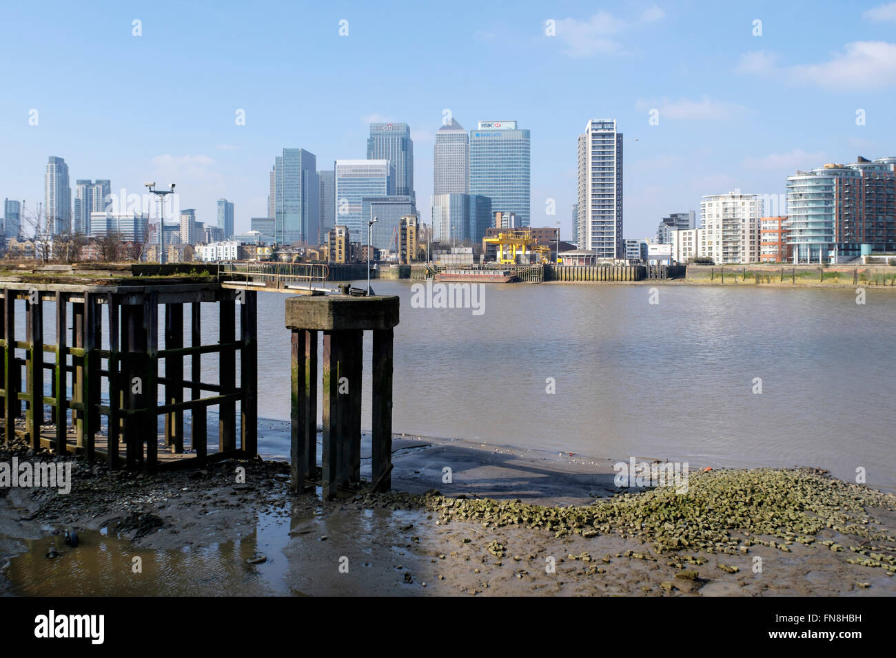 Canary wharf and docklands residential developments from the Thames path, Greenwich Peninsula, London, England, UK Stock Photo