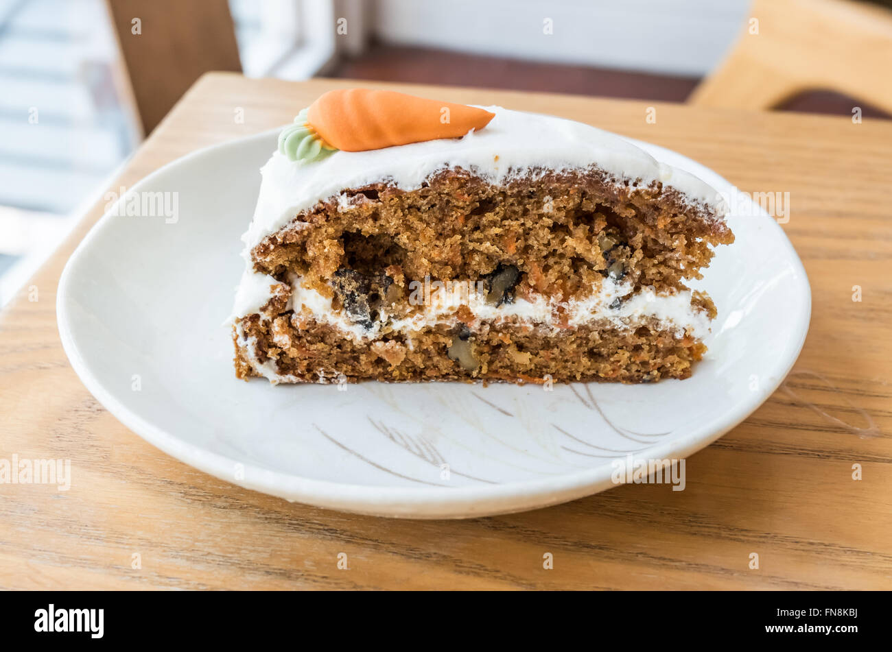 Carrot cake with walnuts and marzipan icing hires stock photography