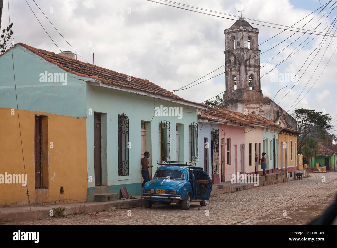 typical Cuban street scene with ruined church Iglesia de Santa Ana at